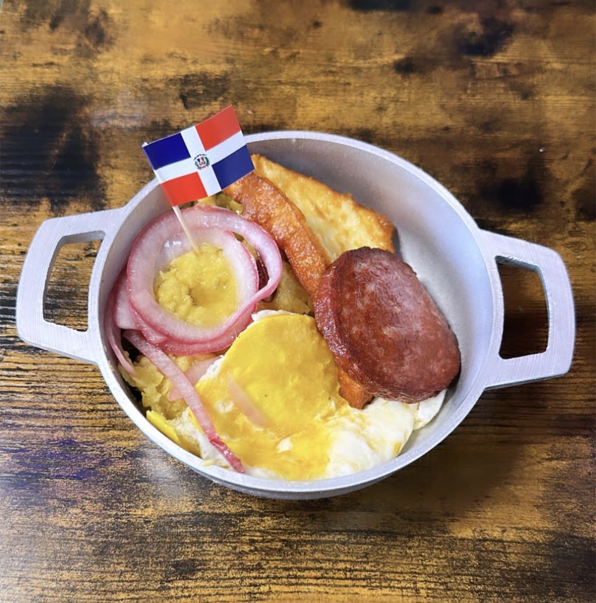 Mangú con los tres golpes — mashed plantains with fried salami, cheese and egg